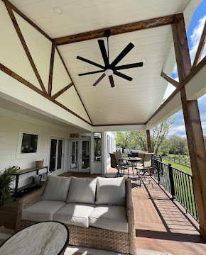 Covered deck with timber beams and ceiling fan